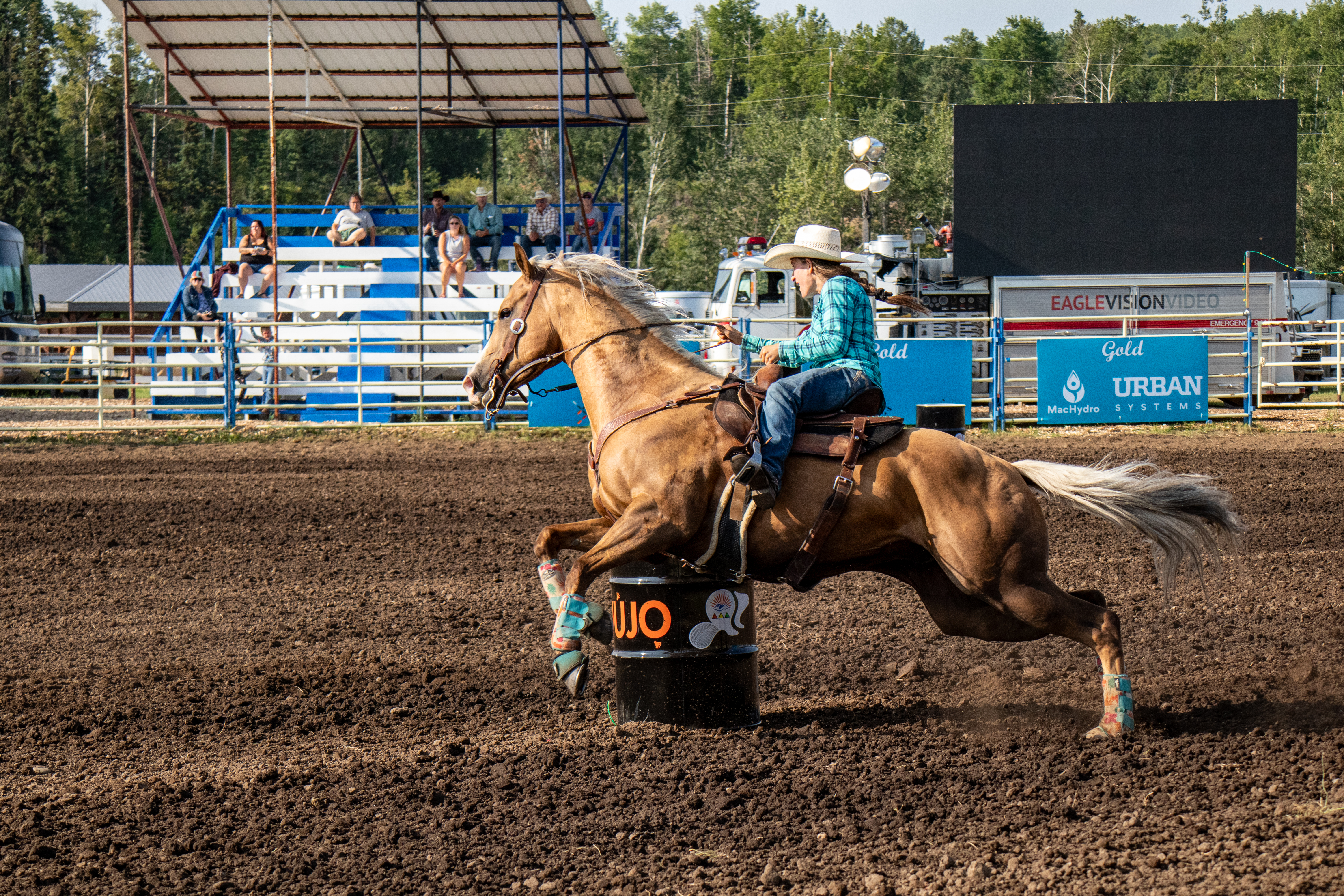 A cowgirl riding a horse